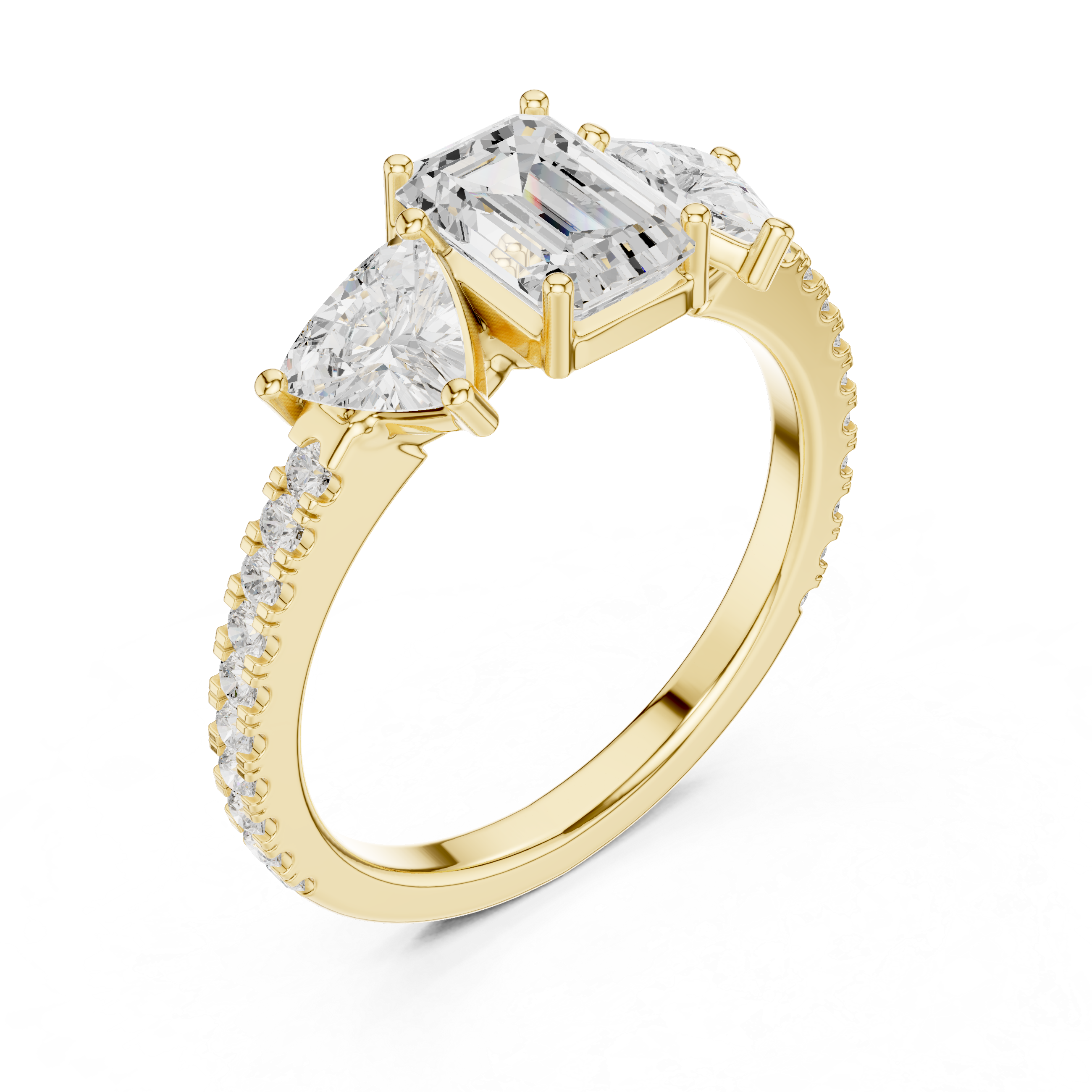 Gold ring with emerald-cut and pear-shaped diamonds on a white background